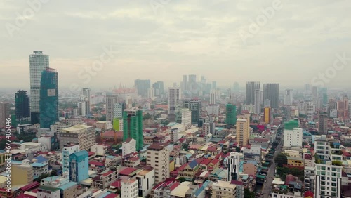 Aerial view the city of phnom penh in the morning with cloudy. 
Phnom Penh cityscapes in tje morning time. Dolly push in drone view. photo