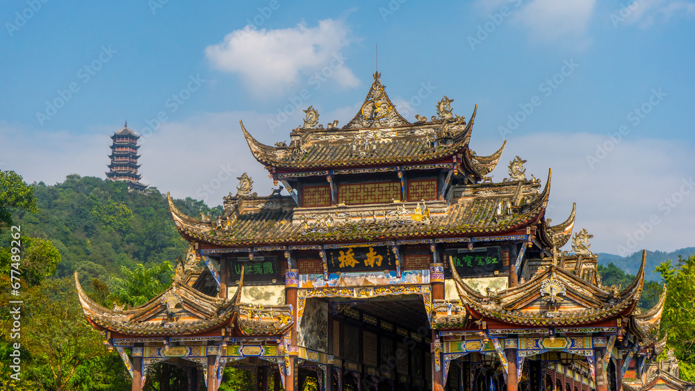 Fototapeta premium Ancient Bridge in Dujiangyan and ancient irrigation system during early autumn at Dujiangyan Sichuan , China : 22 October 2023