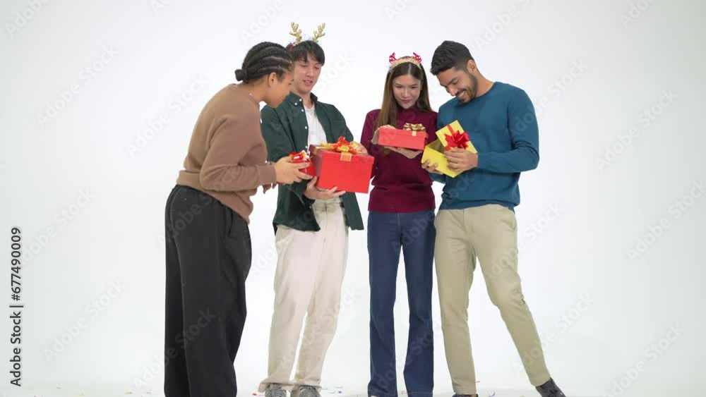 Young Asian friends man woman wearing casual clothes and holding present red box with gifts together isolated on white background studio portrait. concept new year and christmas gifts. Young Asian friends man woman wearing casual clothes and holding present red box with gifts together isolated on white background studio portrait. concept new year and christmas gifts.