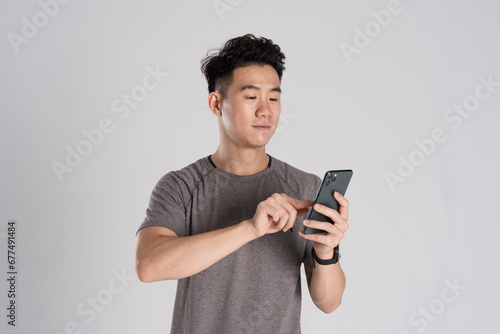 Image of Asian man exercising on white background