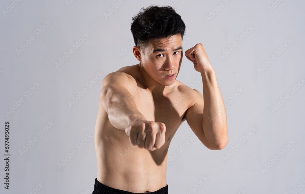 Image of Asian male athlete with good physique on white background