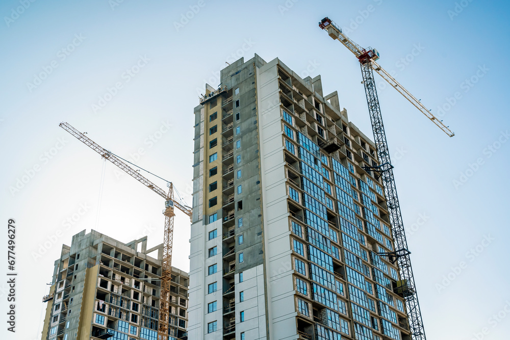 Construction of a building. Construction site with crane. Business, development, industry. Construction of a building. Construction site with crane. Business, development, industry.
