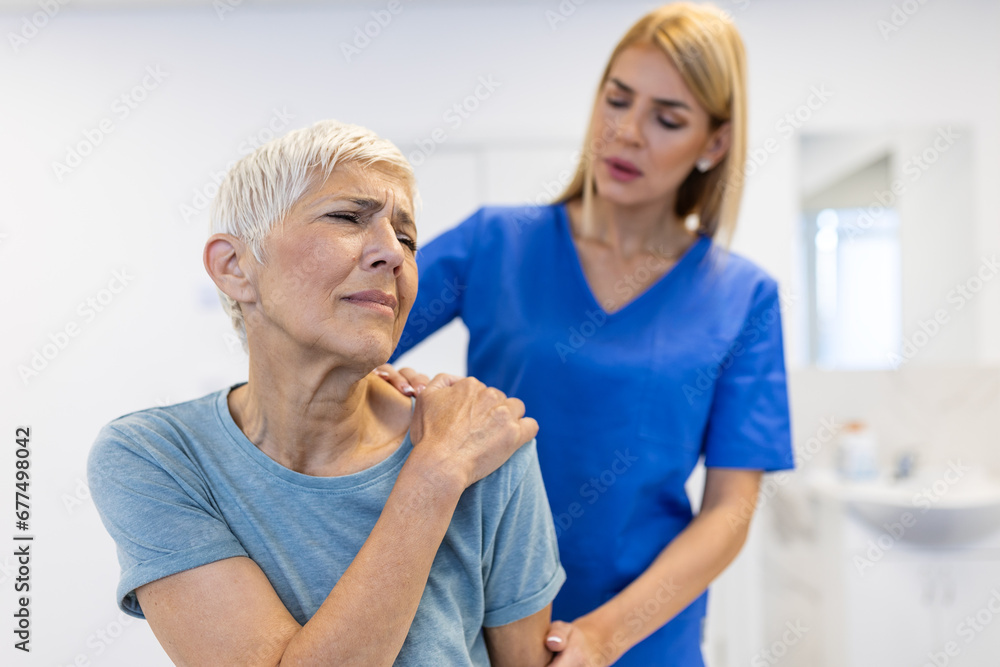 custom made wallpaper toronto digitalWoman doctor osteopath in medical uniform fixing senior woman patients shoulder and back joints in manual therapy clinic during visit. Professional osteopath during work with patient concept