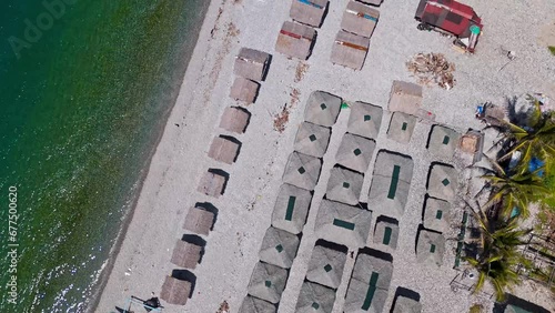 Overhead Drone View of Mabua Beachfront Huts in Surigao, Philippines photo