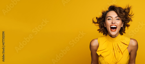 Happy excited lady on yellow background