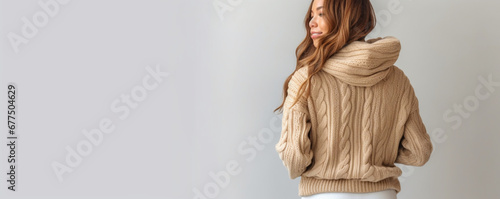 Website header fashionable in warm sweater standing on white background  Copy  empty space for your advertise text