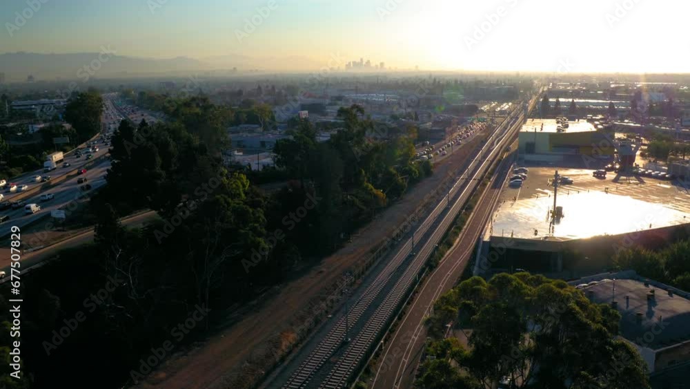 Aerial Forward Beautiful View Of Railroad Tracks In City, Drone Flying Forward During Sunset - Culver City, California Aerial Forward Beautiful View Of Railroad Tracks In City, Drone Flying Forward During Sunset - Culver City, California