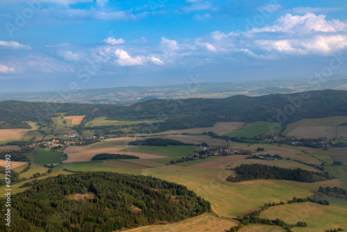 View on spring landscape with villages in a valley in Czech Republic. © martinlisner