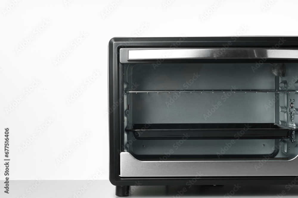 Close up of black mini electric oven home appliance Close up of black mini electric oven home appliance