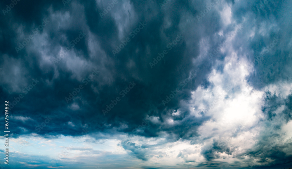 Dramatic storm clouds over panoramic scenic horizon.