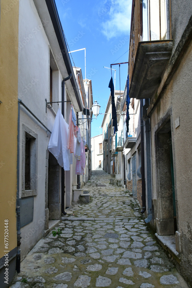 A narrow street among the old houses of Frigento, a town in Campania in Italy.