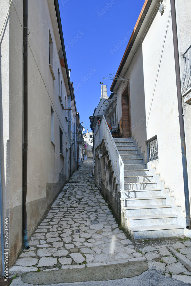 A narrow street among the old houses of Frigento, a town in Campania in Italy.