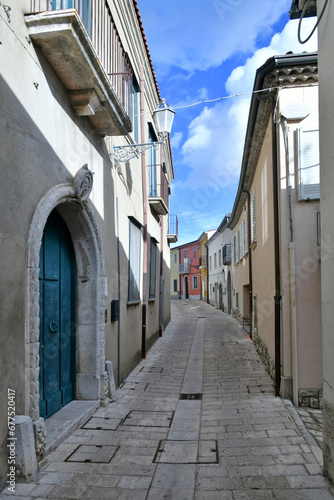 A narrow street among the old houses of Frigento  a town in Campania in Italy.