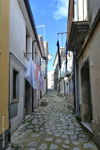 A narrow street among the old houses of Frigento, a town in Campania in Italy. photo