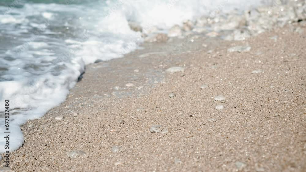 Cinematic slow-motion close-up of the sea surface and waves on the shore Cinematic slow-motion close-up of the sea surface and waves on the shore