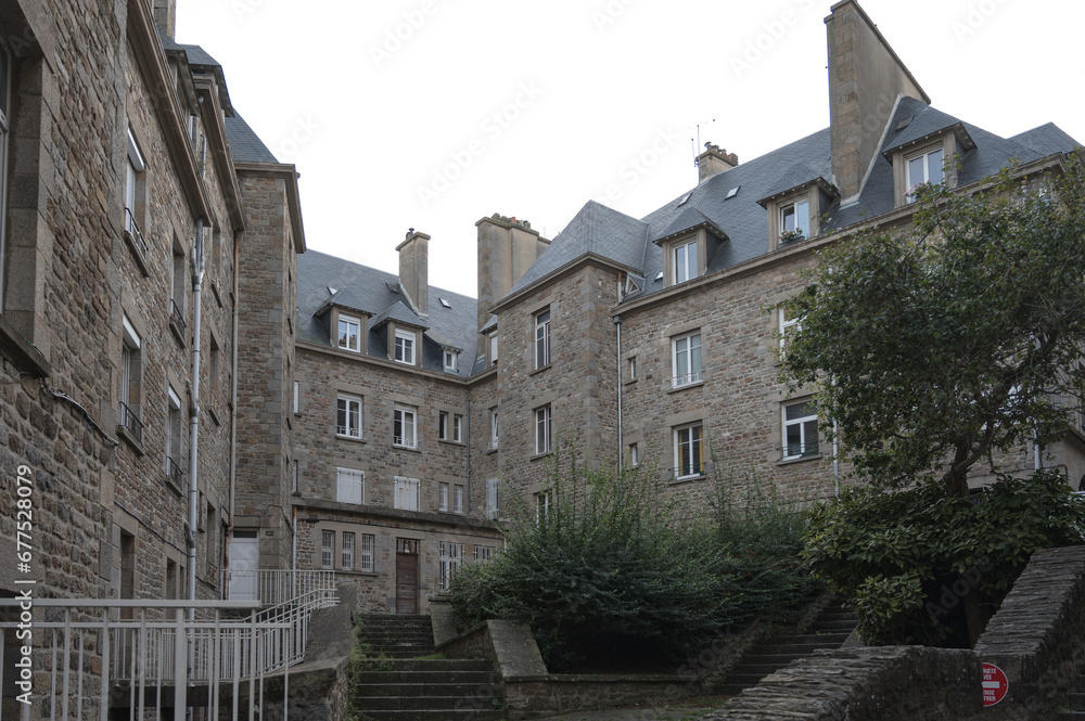 Detail of an area of ​​residential houses in Saint Malo, interior patio and stairs