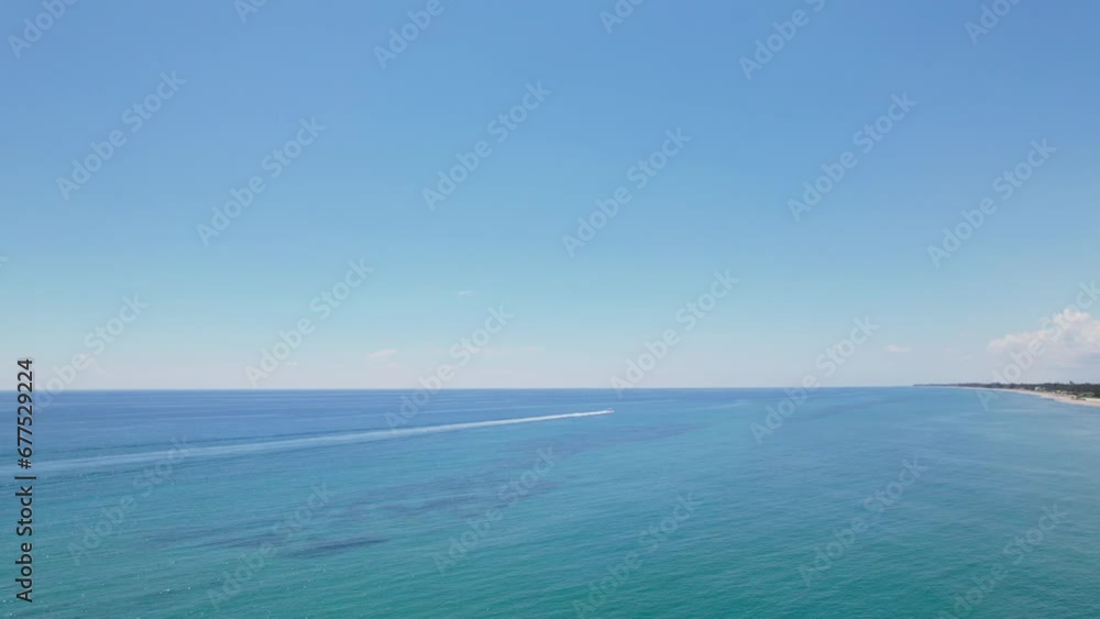 Boats passing by water Aerial drone view of west palm beach skyline downtown area and beautiful beach sand and boats in water Boats passing by water Aerial drone view of west palm beach skyline downtown area and beautiful beach sand and boats in water