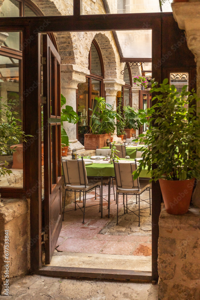 Fototapeta premium Kotor, Montenegro street in old town and cafe