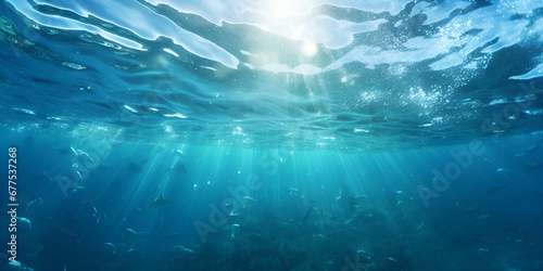 Underwater turquoise texture in ocean. Sun rays in tropical sea. © ALI
