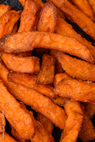 Delicious crispy sweet potato fries with salt  spices and herbs