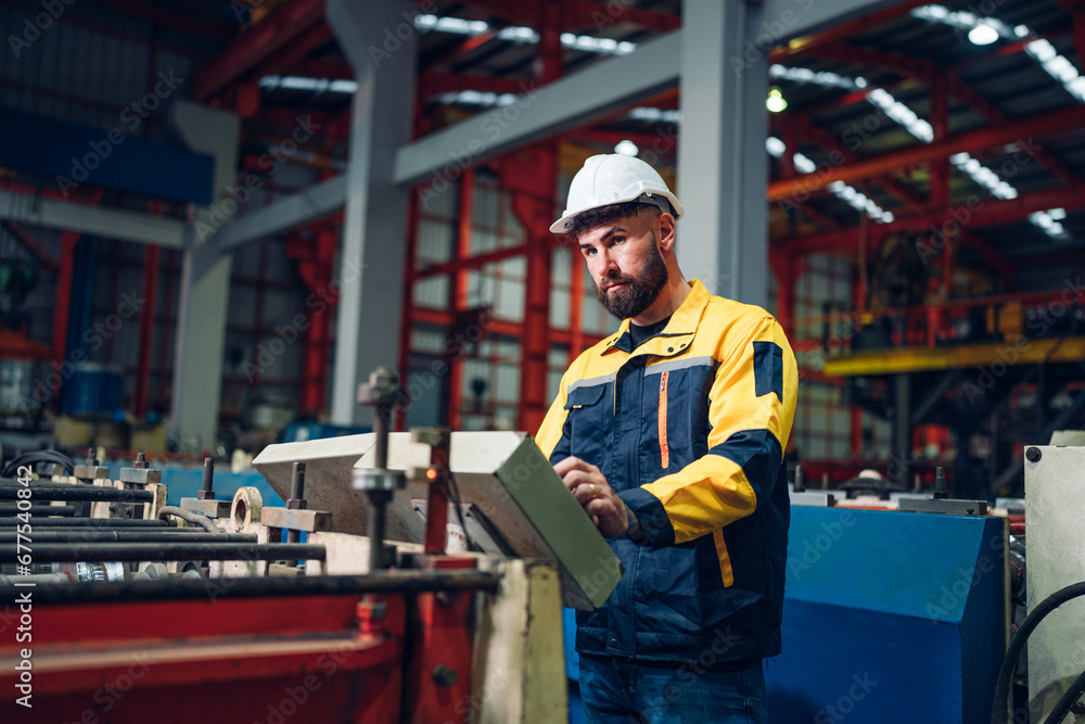 Industrial man engineer wear uniform working and checking system machine at factory. Workers industrial factory. Machine maintenance technician operation concept. Industrial man engineer wear uniform working and checking system machine at factory. Workers industrial factory. Machine maintenance technician operation concept.