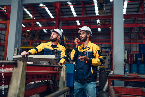 Industrial man engineer wear uniform working and checking system machine at factory. Workers industrial factory. Machine maintenance technician operation concept.