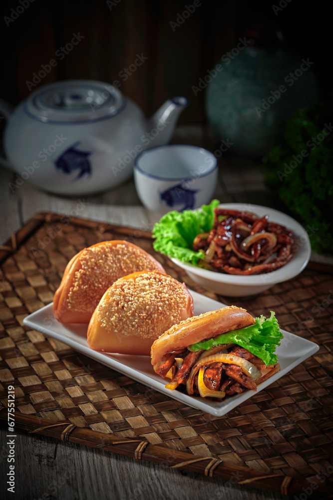 traditional chinese Hong Kong dim sum steamed fresh hot burger man tou with gong bao chicken meat in bamboo basket on grey wood table background breakfast halal food menu for restaurant asian cafe