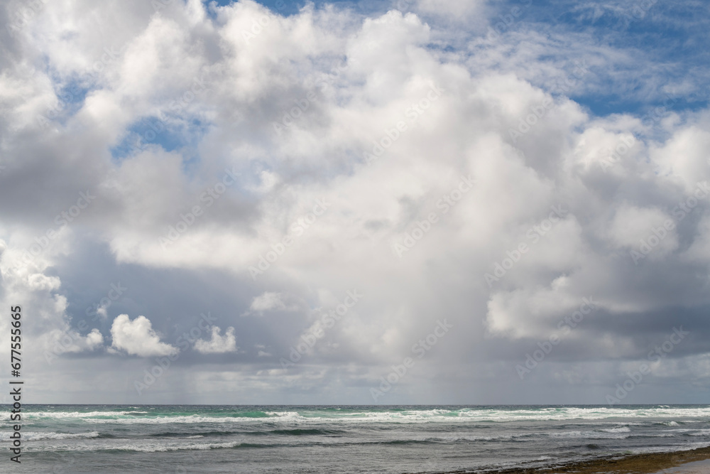 Beautiful white clouds above the Pacific Ocean in Kauai, Hawaii, United States.
