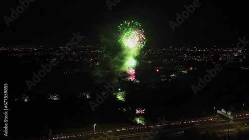 Aerial dolly shot of fireworks being set off on bonfire night in the UK photo