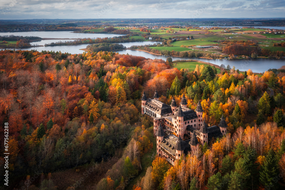 Obraz premium Castle in Lapalice, surrounded by Kashubian forests and lakes at autumn, Poland