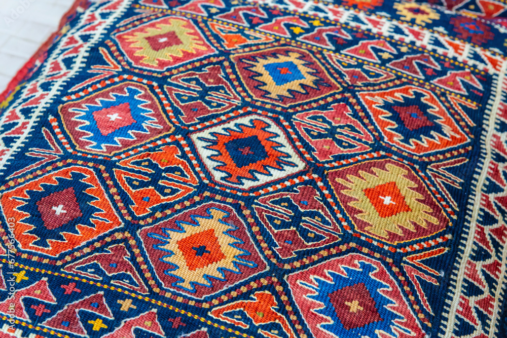 Fragment of traditional Turkish multicolor carpet. Travelling and shoping, traditional sovenir. Istanbul, Turkey Fragment of traditional Turkish multicolor carpet. Travelling and shoping, traditional sovenir. Istanbul, Turkey