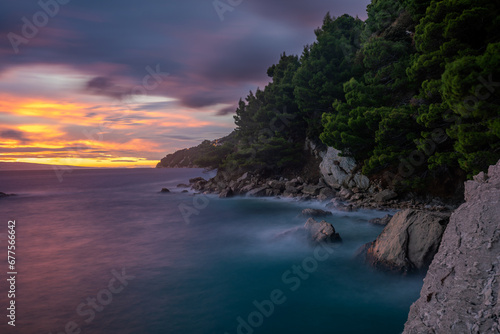 Spectacular landscape of the rocky coastline on the Makarska Riviera during a stormy sunset © Mike Mareen