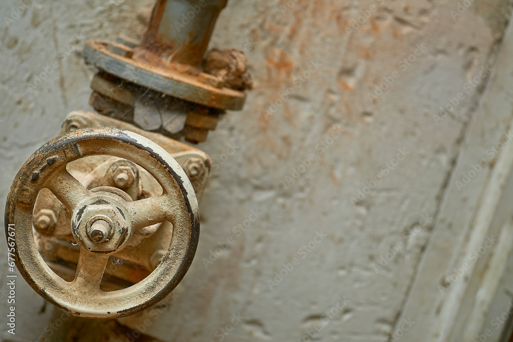 Plumbing. Sewage. Water valve, old rusty faucet in the basement Plumbing. Sewage. Water valve, old rusty faucet in the basement