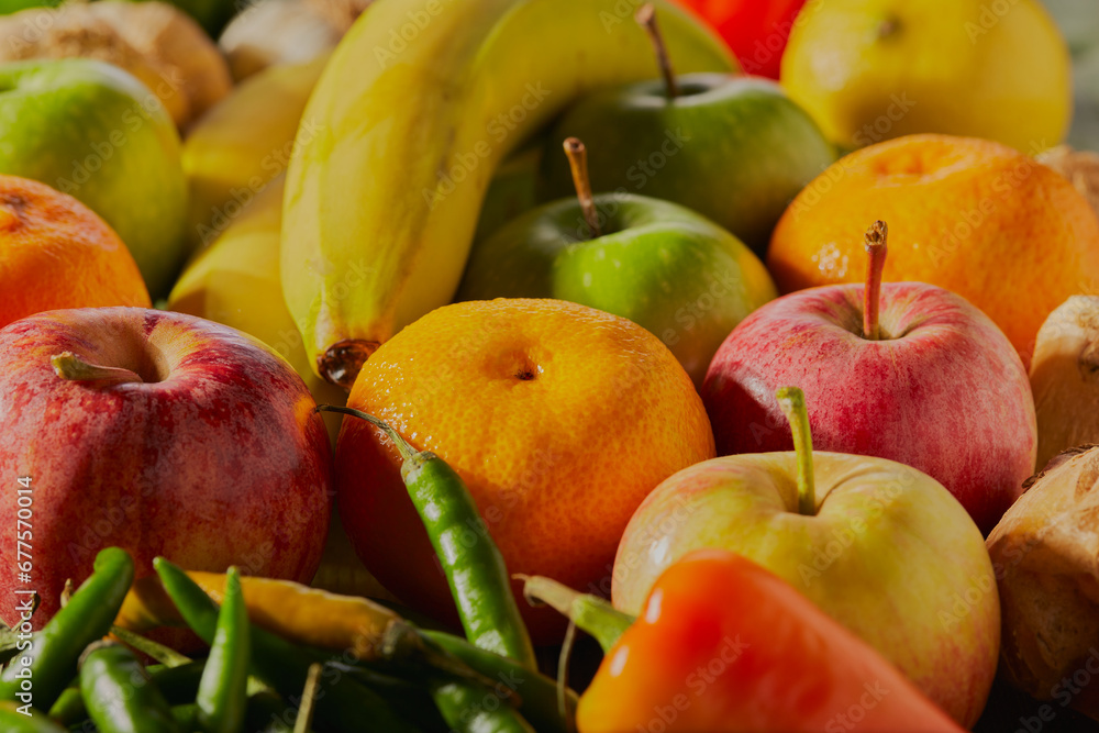 Colourful mixed vegetables and fruit stacked together in a group. Colourful mixed vegetables and fruit stacked together in a group.