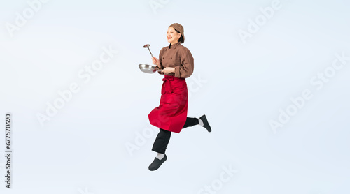 ジャンプする調理服を着た女性　調理師　飲食店店員　切り抜き全身写真（切り抜き背景透過PNGも販売しております。作成者リンクから「PNG」で検索してください） photo