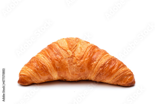 Crispy traditional croissant on a white background. Homemade baking