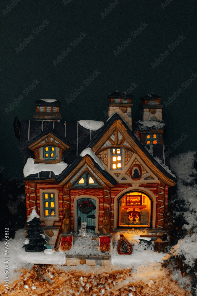 New Year and Christmas toys decorations with Christmas tree, snow and cozy vintage house. Luxury gifts and decorations for the winter holidays