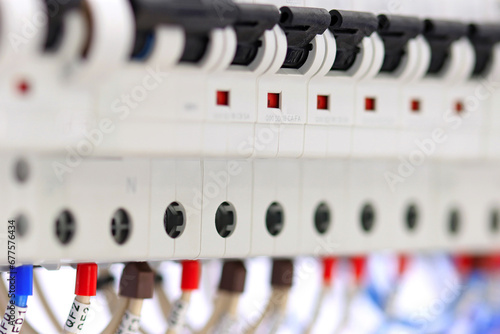 Included circuit breakers to protect electrical loads, close-up. Soft focus.