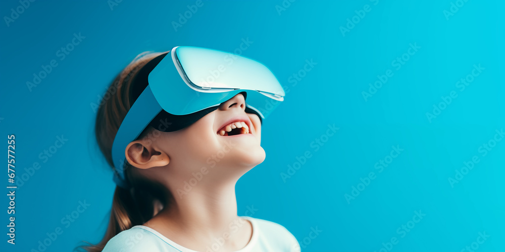 Young girl getting experience using VR headset glasses isolated on a blue background with copy space Young girl getting experience using VR headset glasses isolated on a blue background with copy space