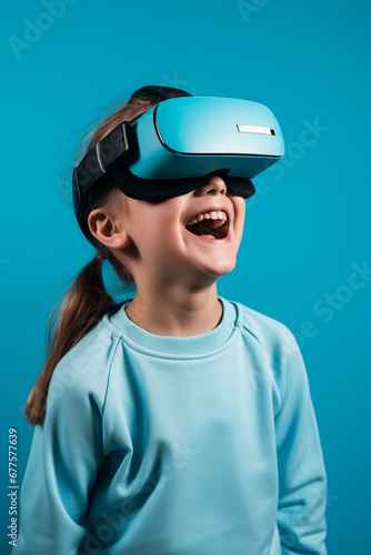 Young girl getting experience using VR headset glasses isolated on a blue background