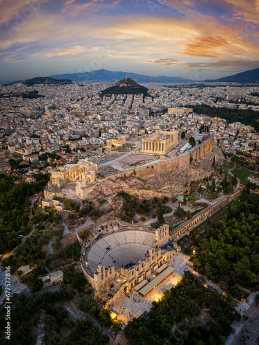 Obraz na płótnie Aerial view of the skyline and ancient ruins at the Acropolis of Athens, Greece, and Odeon of Herode theatre during sunset time w salonie