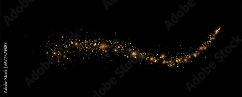Golden sequins glow with many lights. Glittering dust. Luxurious background of golden particles.	