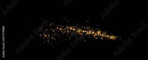 Golden sequins glow with many lights. Glittering dust. Luxurious background of golden particles.	