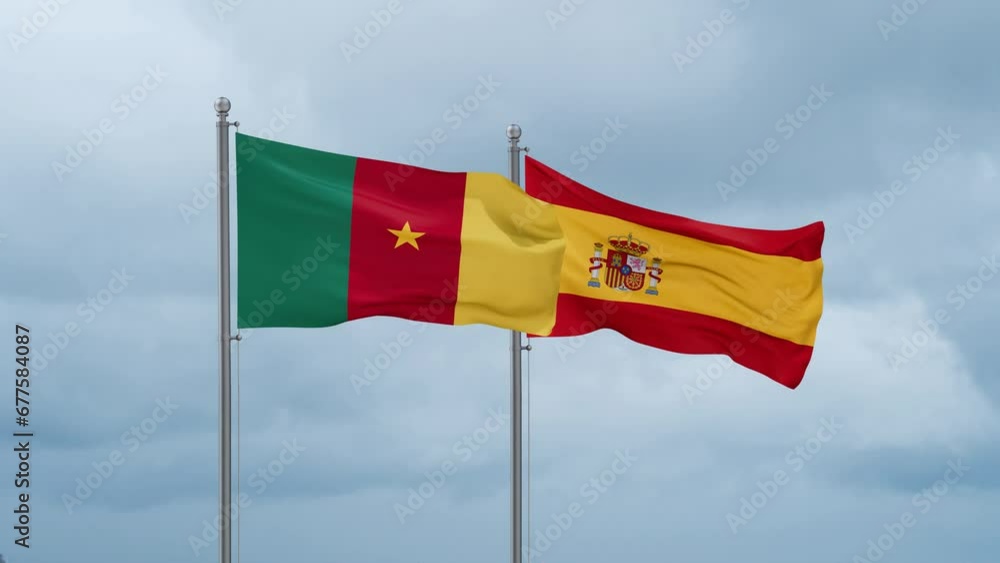 Spain and Cameroon flag waving together on cloudy sky, endless seamless loop, two country cooperation concept Spain and Cameroon flag waving together on cloudy sky, endless seamless loop, two country cooperation concept