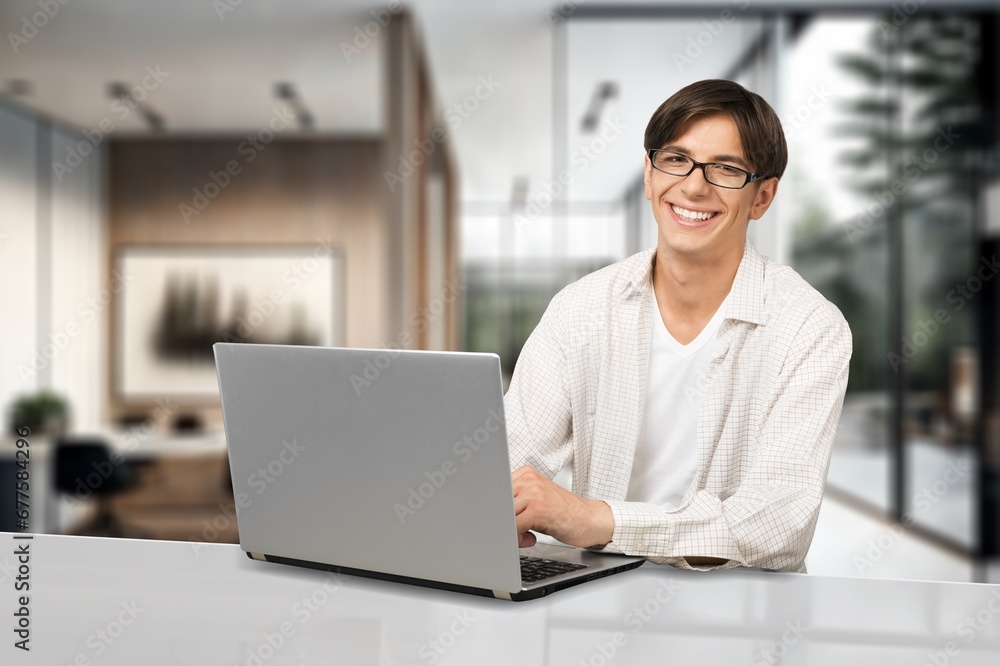 Confident smiling man using laptop, AI generated image Confident smiling man using laptop, AI generated image