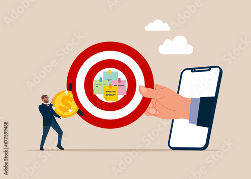 Businessman put coin on big dartboard target. Goal setting, purposeful objective. Subscribe online service and pay recurring price, membership payment to use software on content