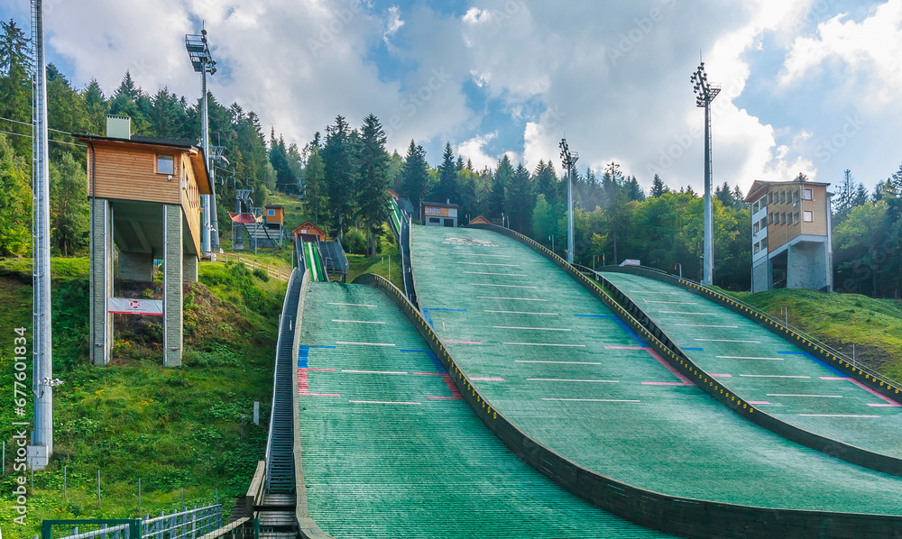 Ski jump complex Skalite in the center of the tourist town - Szczyrk in the Silesian Beskids (Poland) on a sunny autumn afternoon.