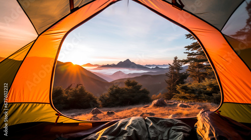 Sunrise view from inside a tent overlooking mountains.