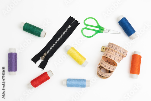 Sewing supplies and threads on a white background