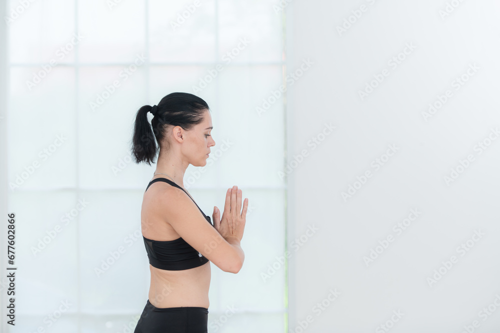Beautiful young woman practicing yoga at home. Yoga asana. Beautiful young woman practicing yoga at home. Yoga asana.